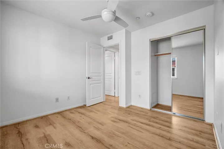 Bedroom #2 with Mirrored Wardrobes and Ceiling Fan