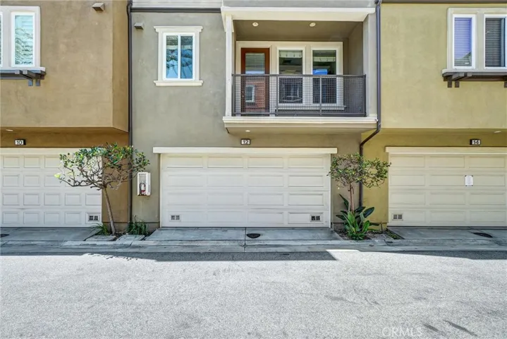 Attached two-car Garage with direct access to downstairs office/bedroom and to staircase to upstairs living area