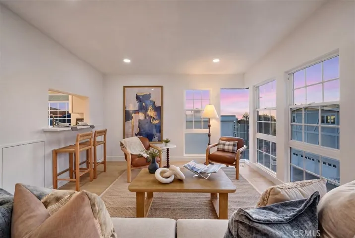 Living room with ocean views and floor to ceiling windows.