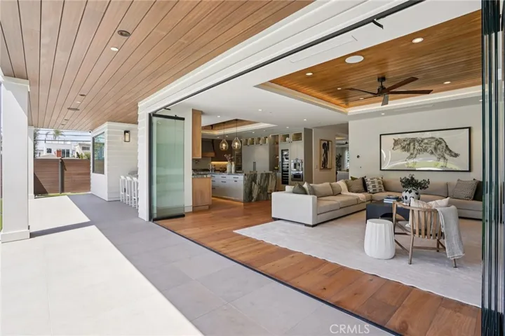 Custom folding doors open the living room for prime indoor/outdoor entertainment