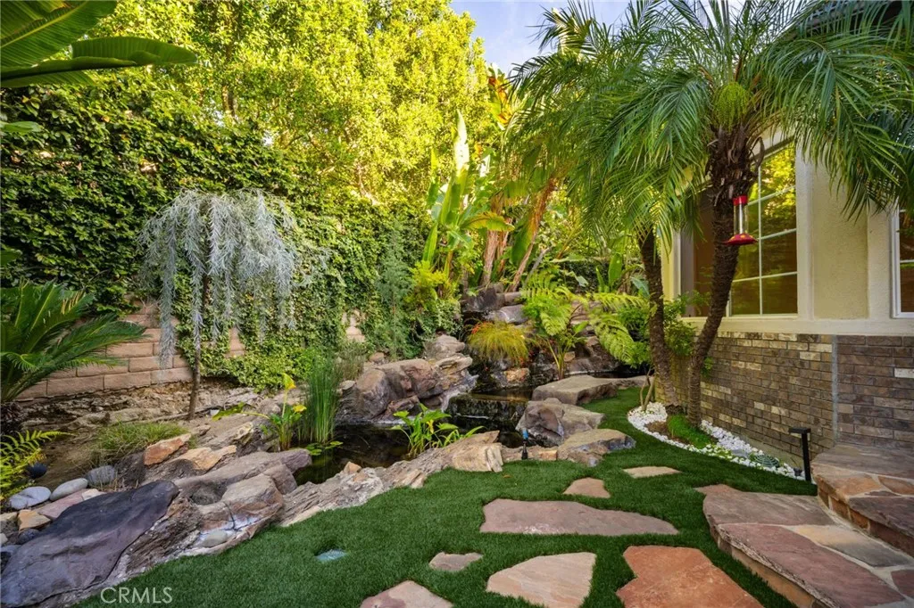Entrance of the home with koi pond