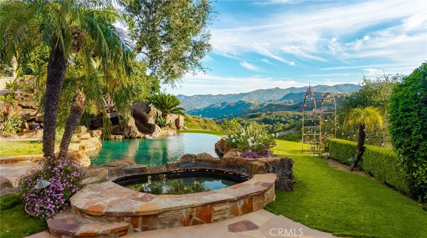 Gorgeous backyard with pool spa, waterfall and slide!