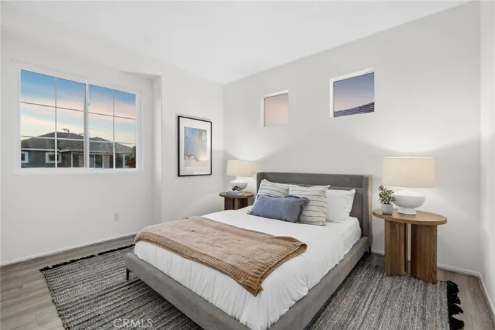 additional secondary bedroom with large windows and two upper windows add plenty of light to this large room.