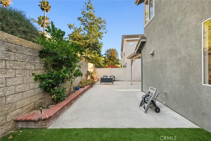 Enjoy fresh turf for the pups and a lovely citrus tree.