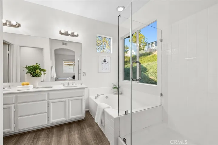 Primary bathroom walk-in shower with glass enclosure