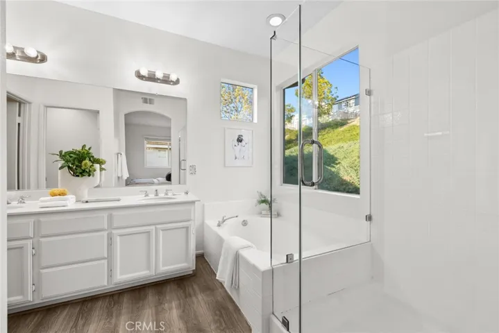 Primary bathroom walk-in shower with glass enclosure