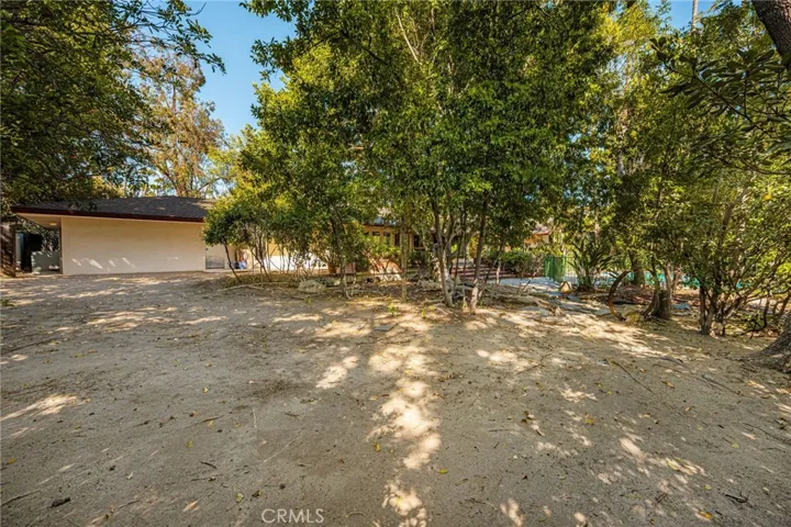 So much room for an ADU, sports court, gardens, chickens...i