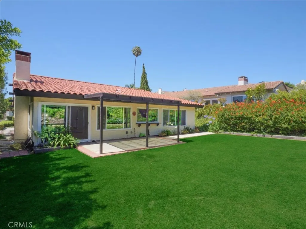 Back Elevation with Grassy Backyard & Patio
