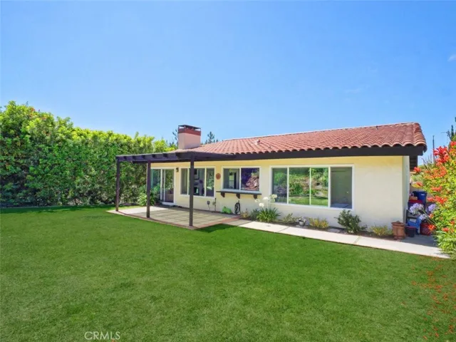 Back Elevation with Grassy Backyard & Patio