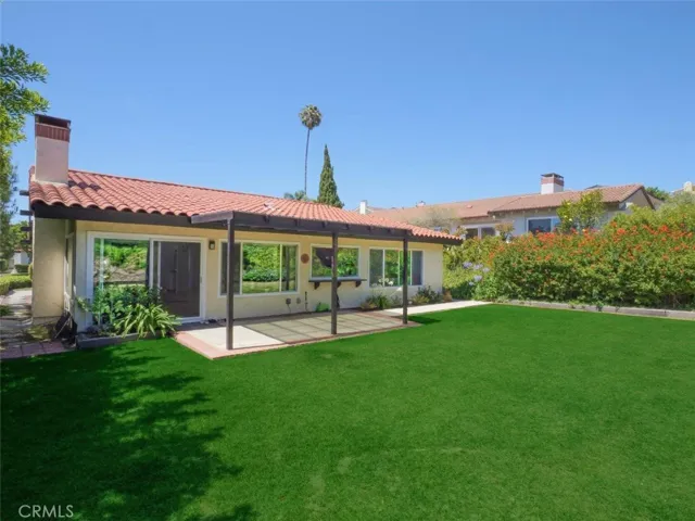 Back Elevation with Grassy Backyard & Patio
