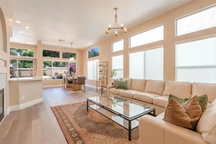 Open living area with abundant natural light and warm finishes.