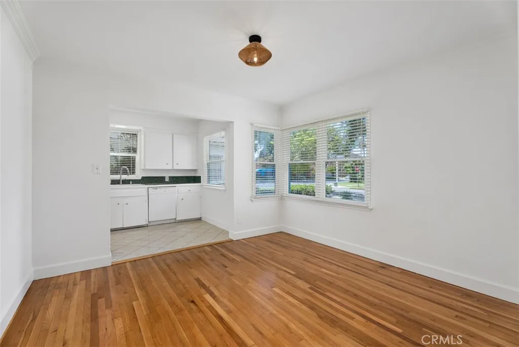 Dining room that opens into galley kitchen.
