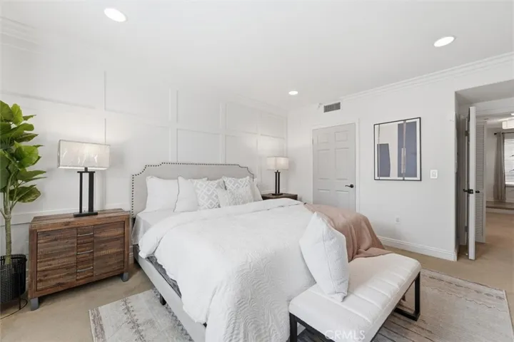 Primary bedroom with two walk-in closets