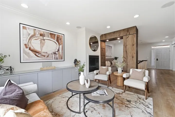 Living opens to the balcony, kitchen and dining room.