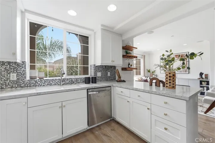 Kitchen opens to living