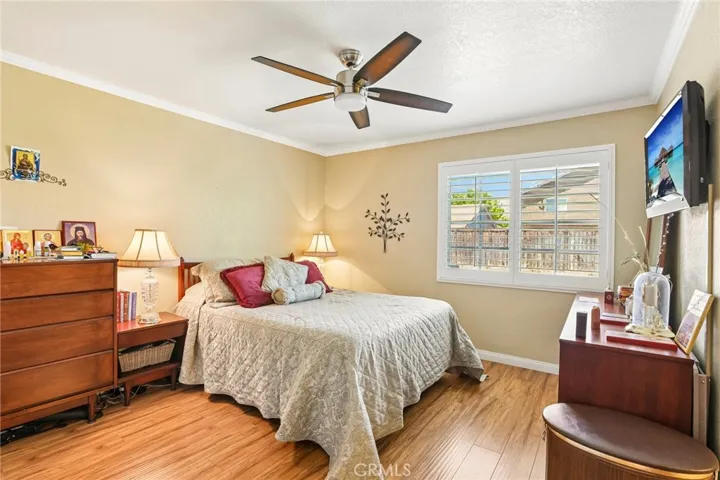Good Sized Primary Bedroom with Crown Molding & Plantation Shutters