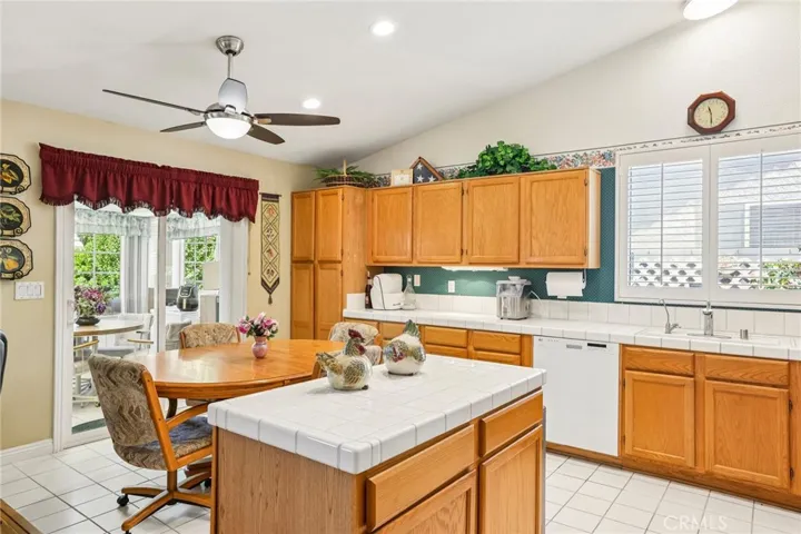 Kitchen Island and Dine-in Kitchen Area. Enclosed Sunroom is Right off the Kitchen!