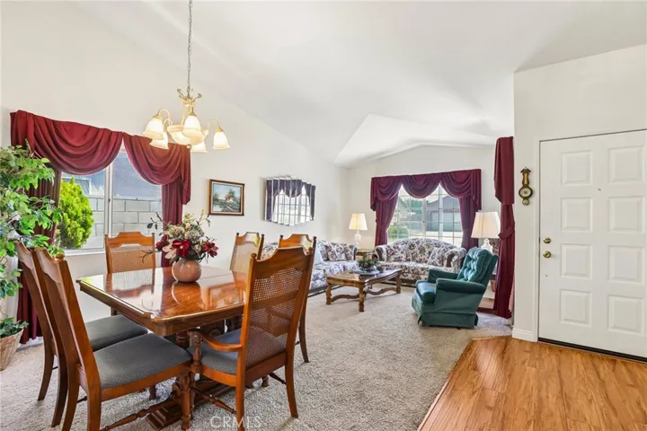 View looking towards the Front Door Entry, Formal Dining Room and Living Room with Vaulted Ceilings & Lots of Natural Light!