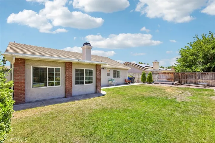 View of Enclosed Sunroom & Expansive Backyard - Plenty of Room!!