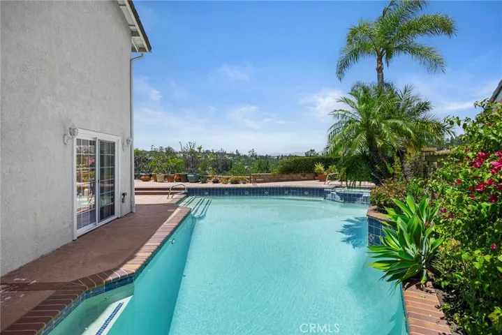 Dining room to the left has direct access with views of the pool area.