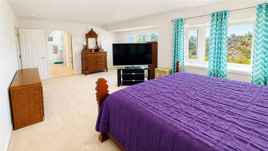 Primary bedroom is expansive and comes with amazing views