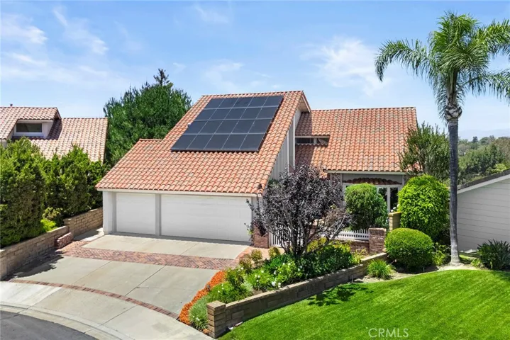 Lovingly maintained and full of potential, this home features owned solar panels, a three-car garage, mature landscaping, and inviting curb appeal.