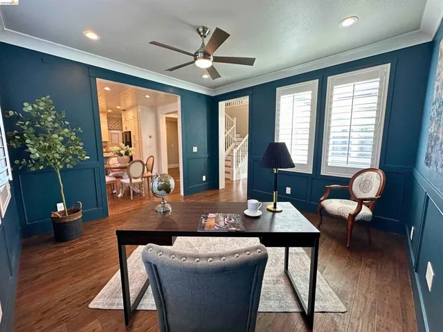 Room featuring dark wood-finish flooring, recessed lighting, and a ceiling fan with light fixture