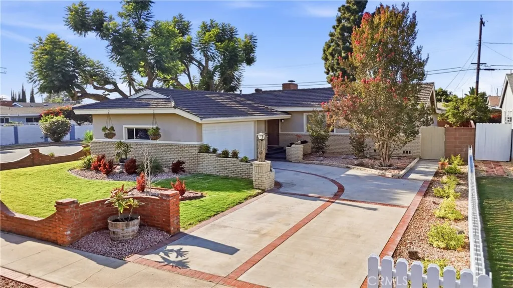 Driveway lined with White Picket Fence.