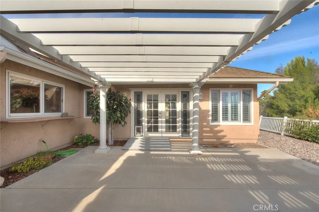 Double Door Entry From Bonus Room To Rear Patio.  Patio Cover Has Electrical Power And Has Been Freshly Painted. Also All The Windows Have Been Upgraded To Vinyl Windows.