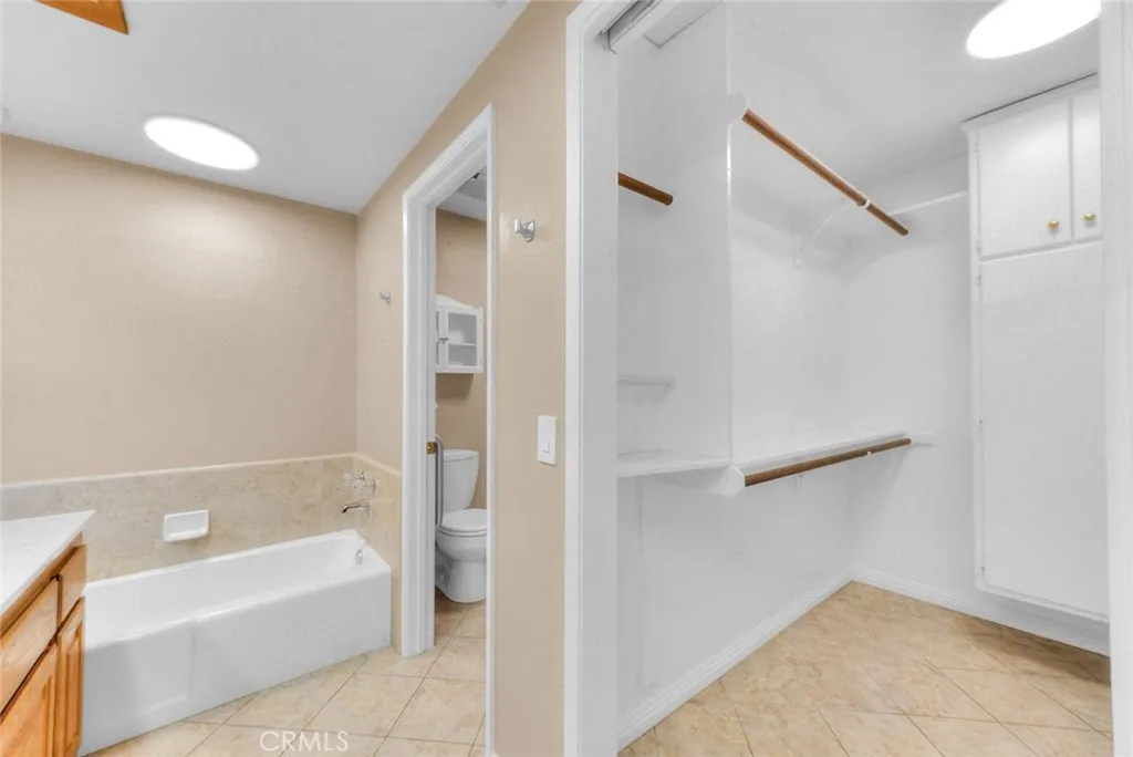 Upon Entry Spacious Walk In Closet To Right Next Tub Next Walk In Shower And Toilet.  New Overhead LED Lighting.