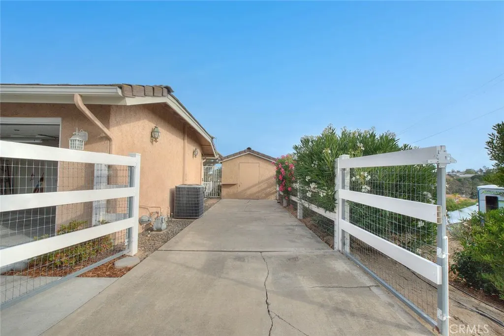 Next To Garage Is Space For RV.  Shed At Rear Offers Even More Storage Space And Has Electrical Power.