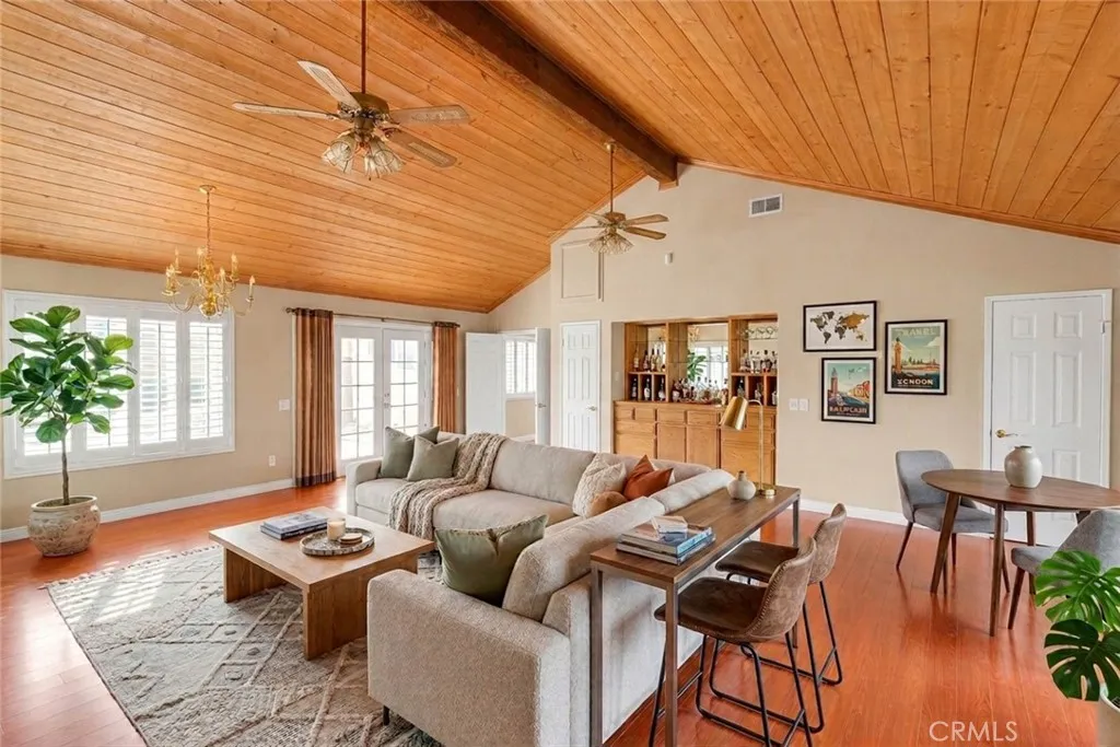 Double Door Entry Leads To Rear Covered Patio From Bonus Room.  Bonus Room With Virtually Staged Furniture