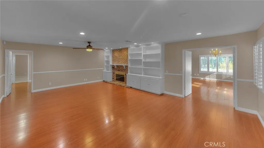 Opposite View Of Living Room.  Double Door Entry To Huge Bonus Room.  Single Door Entry To Left Leads To Bedrooms.