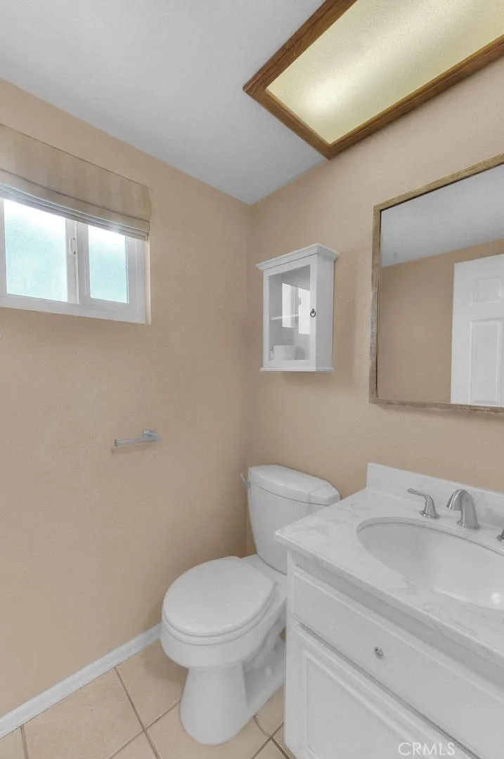 Powder Room Off Utility Room.  New Sink Faucet, Bath Fixtures And Toilet Flushing Mechanism.  Easy Care Tiled Flooring.