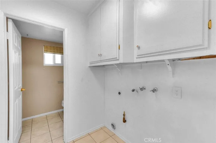 Opposite From Pantry Is Utility Room For Washer And Dryer.  Overhead Cabinets. New Overhead LED Lighting.  Easy Care Tiled Flooring.  Door Leads To Powder Room.