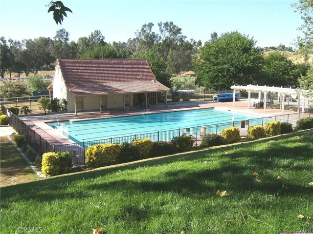 Main Pool With Bathroom And Changing Facility.  Kiddie Pool To The Right