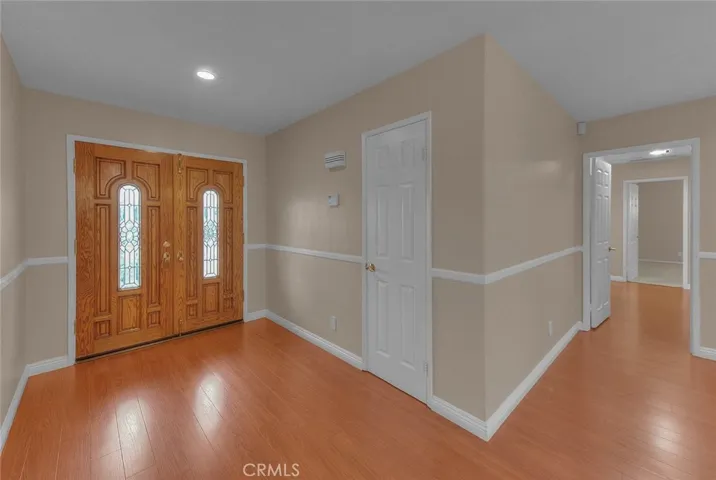 Foyer.  Coat Closet.  Hallway To Bedrooms
