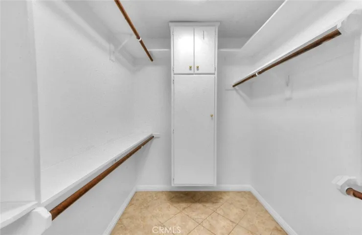 Spacious Walk-in Closet With Builtin Cabinets.  Easy Care Tiled Flooring.  New Overhead LED Lighting With Dual Mode Bright And Night Lite