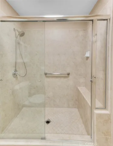 Spacious Walk In Shower With Built In Bench.  New Magnetically Held Shower Head.  New Overhead LED Lighting With Dual Mode Bright And Night Lite