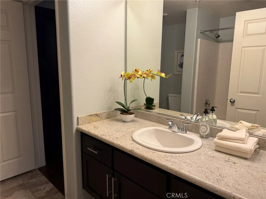 Secondary upgraded full bath cabinetry and granite counters