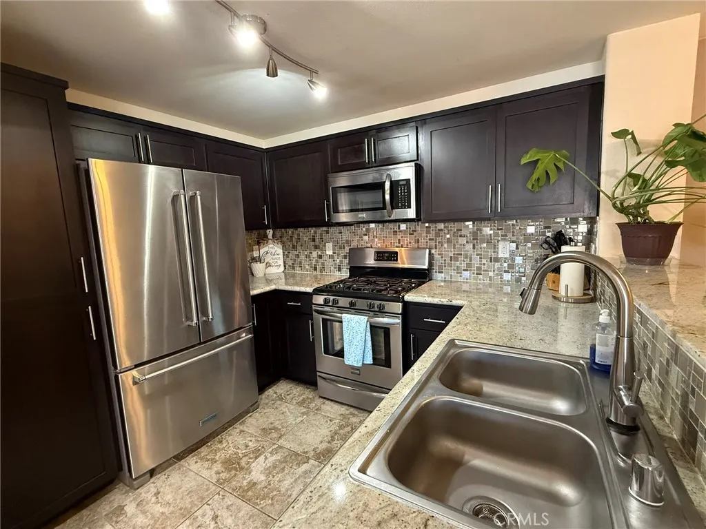 Newly remodeled kitchen with new Granite counters, cabinetry and stainless appliances