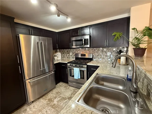 Newly remodeled kitchen with new Granite counters, cabinetry and stainless appliances