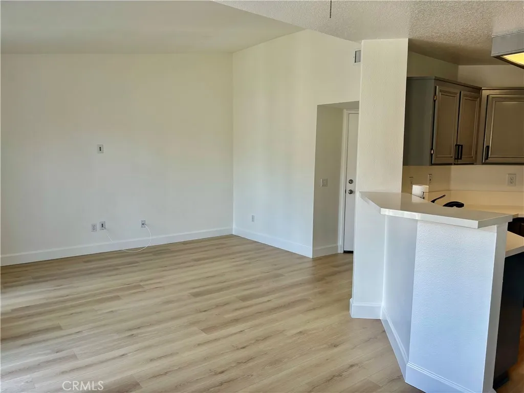 Dining Area Toward Living Room With  High Ceiling