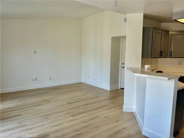 Dining Area Toward Living Room With  High Ceiling