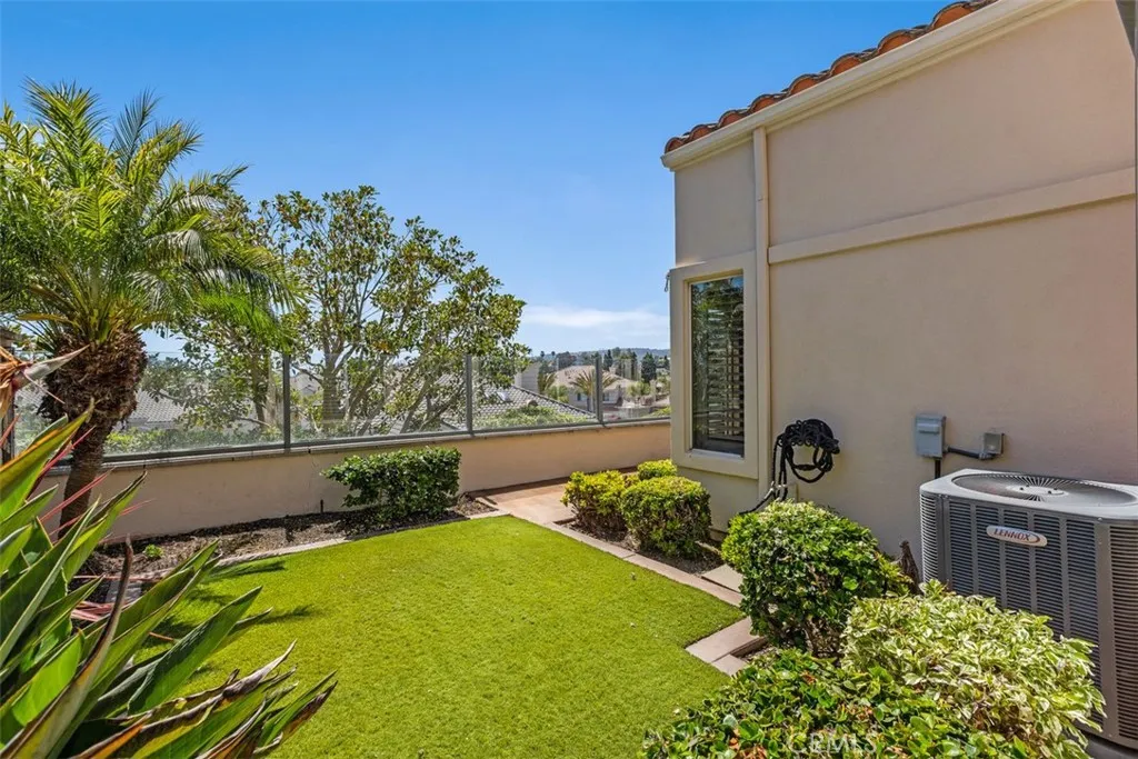 Grassy area on the other side of the wrap around yard space