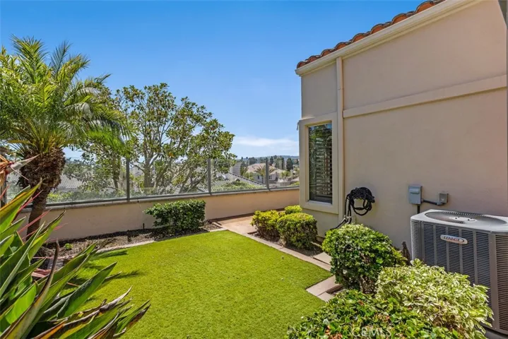 Grassy area on the other side of the wrap around yard space