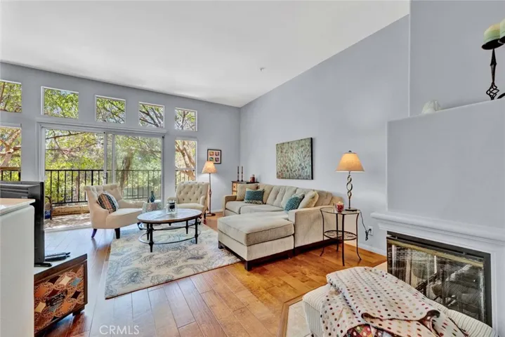 Soaring ceilings and windows galore open to your tranquil patio from the family room with fireplace.