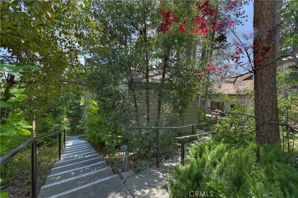 Cement path to the right is wheelchair accessible to main level