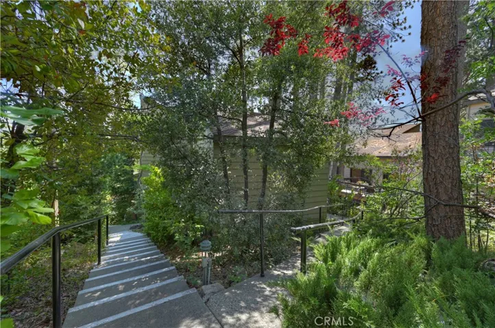 Cement path to the right is wheelchair accessible to main level