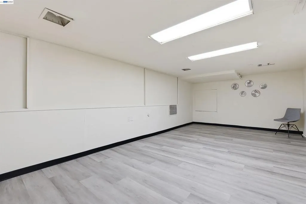 2nd large room with new flooring. Potential bedroom(s)
